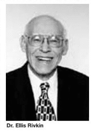 A black and white photo of an older man wearing glasses.